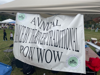 Banner that reads Annual Dancy by the River Traditional Pow Wow